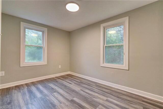 1013 Dare Rd, Yorktown, VA 23692 - unfurnished room featuring dark wood-style flooring and baseboards
