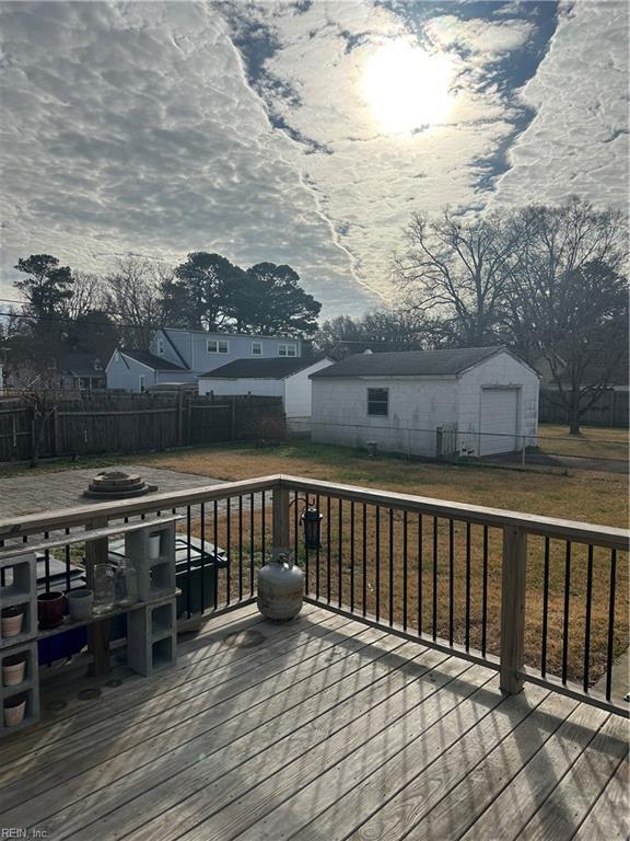 wooden deck featuring a yard