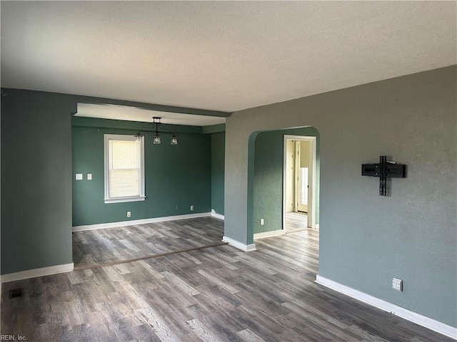 unfurnished room featuring wood-type flooring