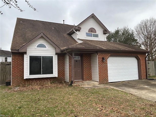 view of front of home with a garage and a front yard