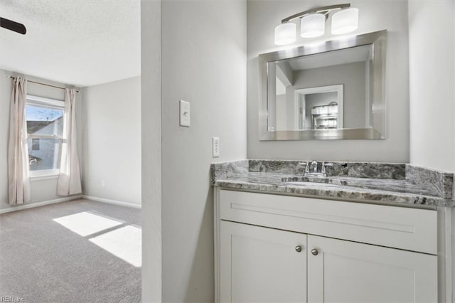 bathroom featuring vanity and a textured ceiling