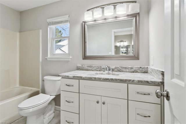 full bathroom featuring shower / bathing tub combination, vanity, and toilet