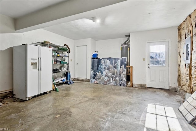 garage with white refrigerator with ice dispenser and water heater