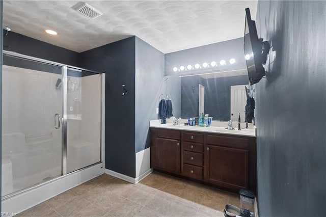 bathroom with vanity and walk in shower