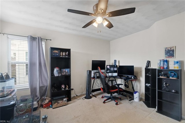 carpeted home office with ceiling fan