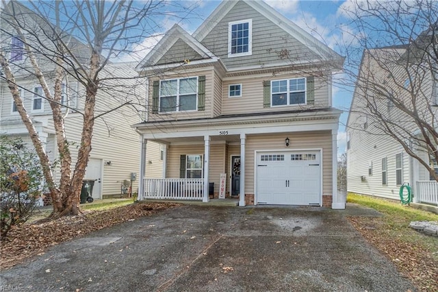 view of front of house featuring covered porch and a garage