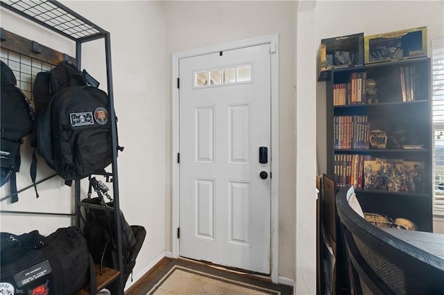 interior space with plenty of natural light and hardwood / wood-style flooring