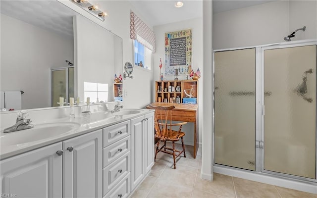 bathroom featuring tile patterned flooring, vanity, and an enclosed shower