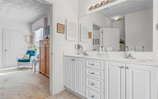 bathroom featuring tile patterned flooring and vanity