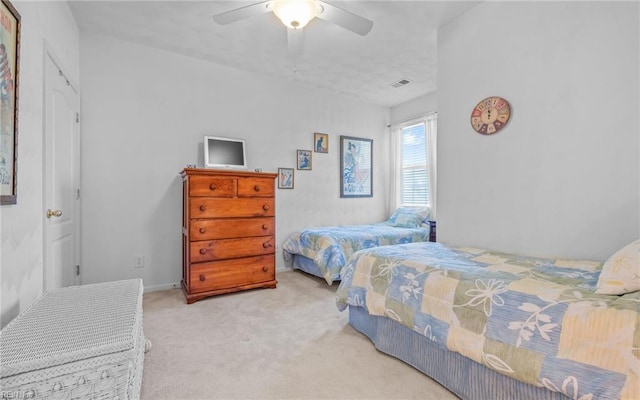 bedroom with ceiling fan and carpet floors