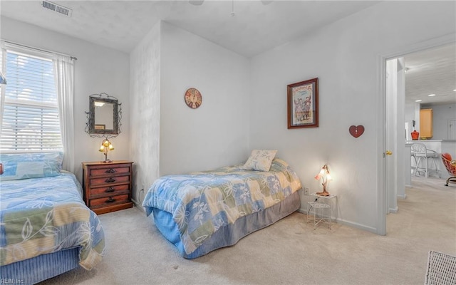 carpeted bedroom featuring ceiling fan