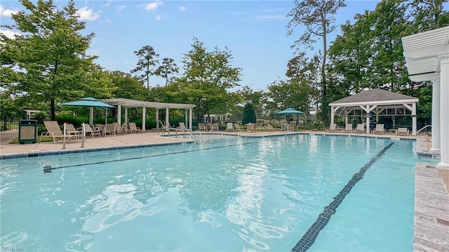 view of swimming pool with a gazebo and a patio