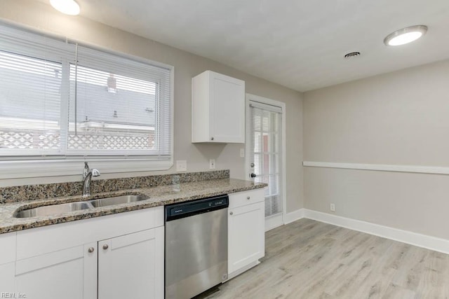 kitchen featuring light stone countertops, sink, light hardwood / wood-style flooring, dishwasher, and white cabinetry