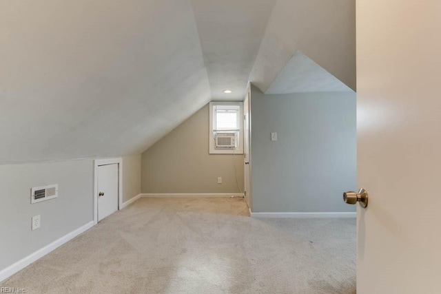 bonus room featuring light carpet, cooling unit, and lofted ceiling