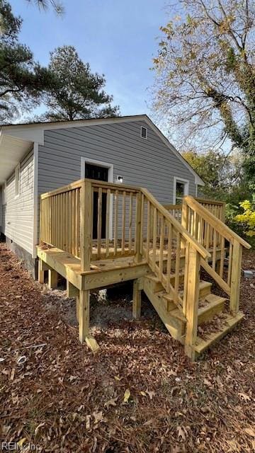 back of house featuring a deck