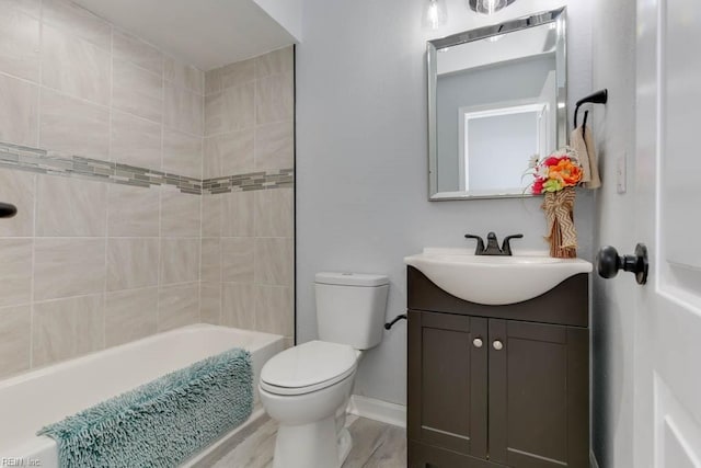 full bathroom featuring vanity, toilet, wood-type flooring, and tiled shower / bath combo