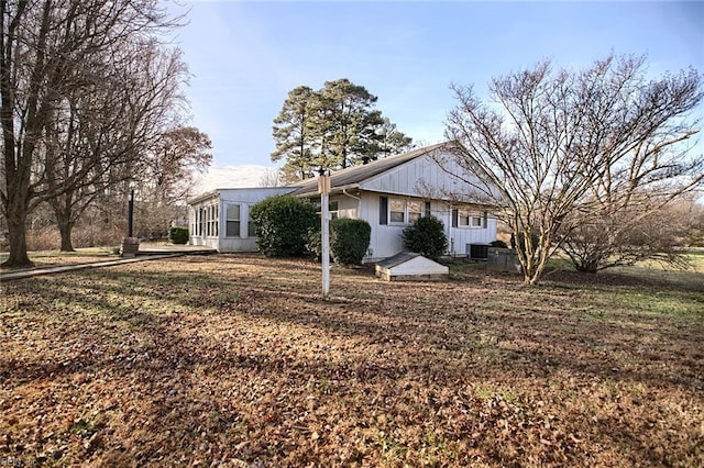 view of side of property with central AC