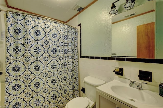 bathroom with a shower with curtain, vanity, tile walls, and toilet