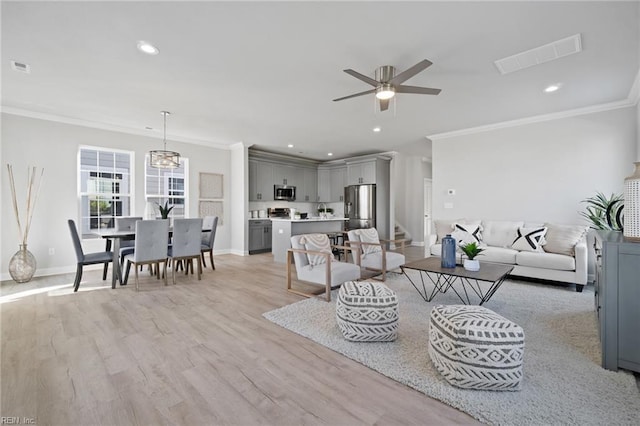 living room with ceiling fan, light hardwood / wood-style floors, and crown molding