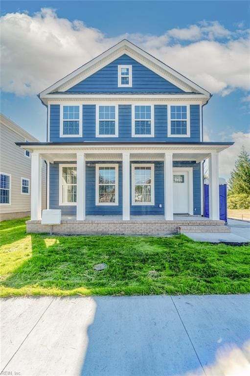 view of front of property featuring a porch and a front yard