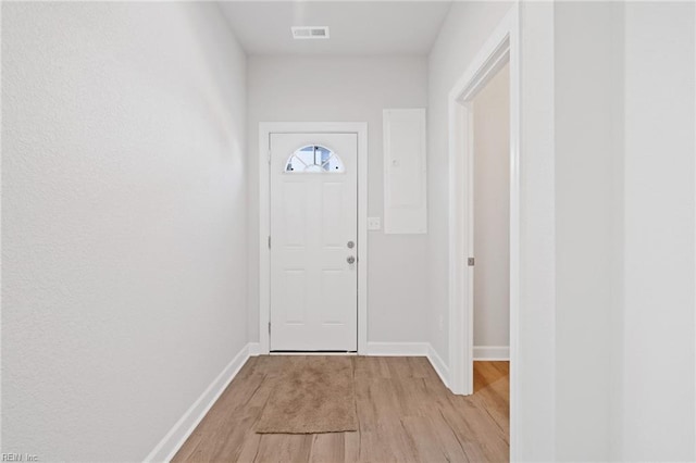 doorway to outside with light wood-type flooring