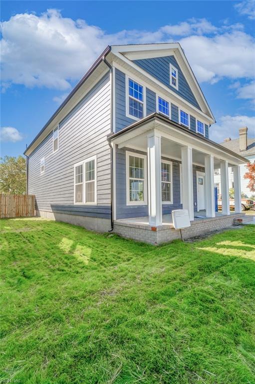 view of home's exterior with a yard