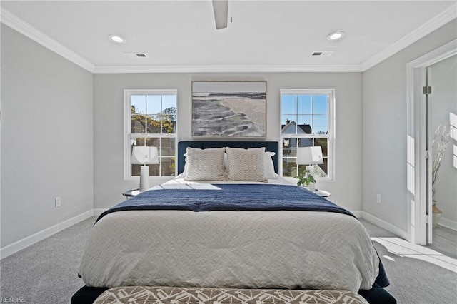 carpeted bedroom featuring crown molding and ceiling fan