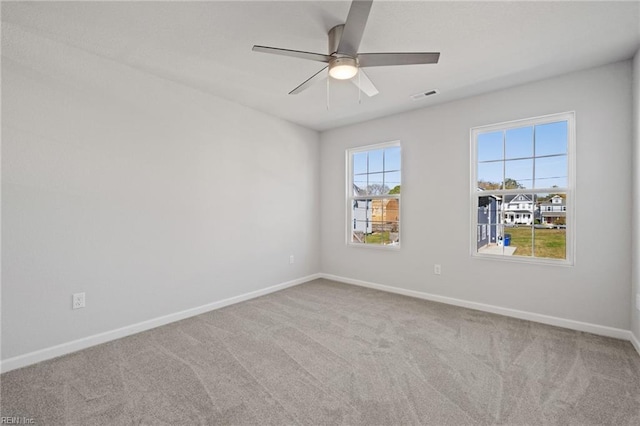 carpeted empty room with ceiling fan