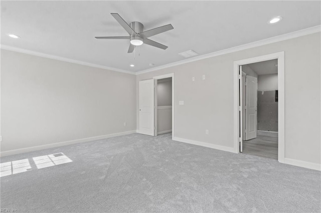 unfurnished bedroom featuring light carpet, ceiling fan, and ornamental molding