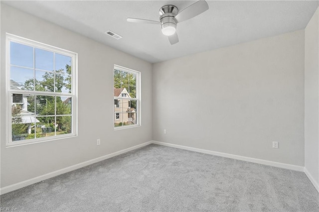 empty room featuring carpet flooring and ceiling fan