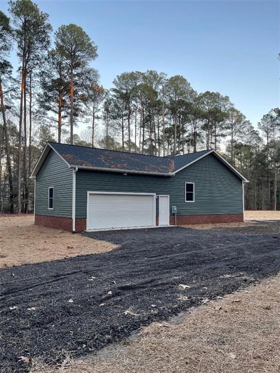 view of property exterior featuring a garage