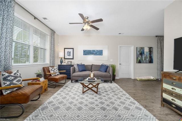 living room with hardwood / wood-style floors and ceiling fan