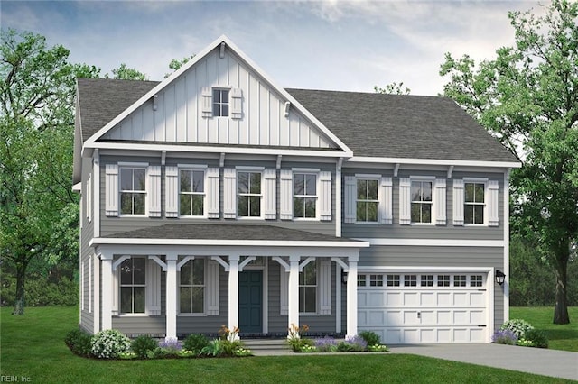 view of front of property featuring a garage and a front lawn