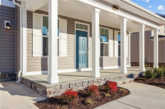 property entrance with covered porch