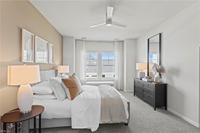 carpeted bedroom featuring ceiling fan