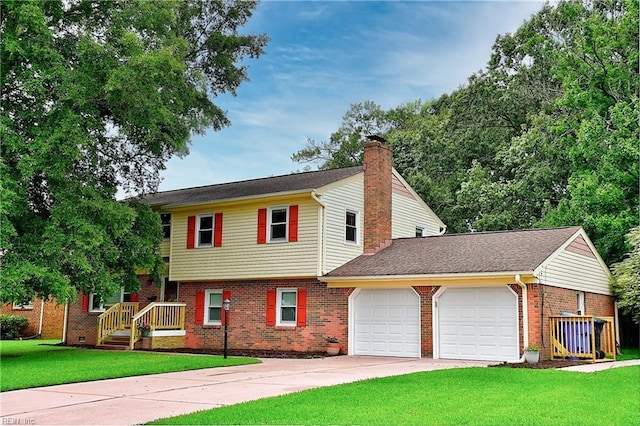 view of front of home with a front yard and a garage