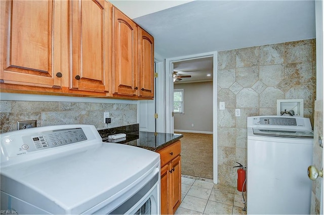 laundry room with cabinets, hookup for a washing machine, ceiling fan, and light tile patterned flooring