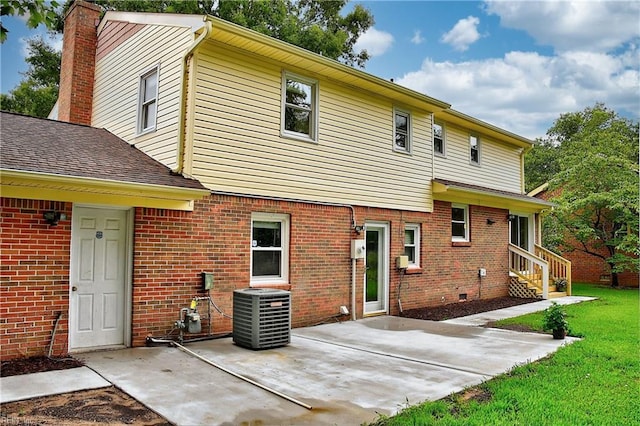 back of house with cooling unit and a patio