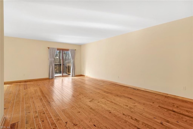 unfurnished room featuring light wood-type flooring