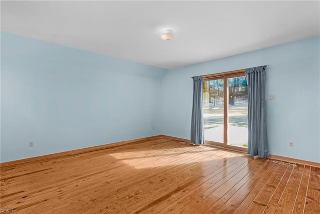 empty room featuring wood-type flooring