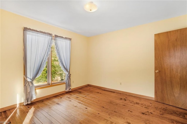 unfurnished room featuring wood-type flooring