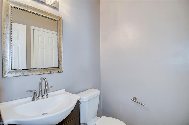 bathroom featuring sink and toilet