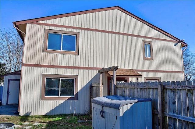 rear view of house with an outdoor structure