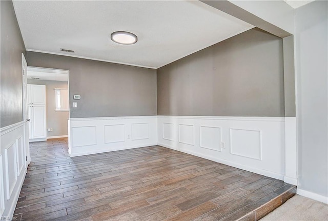 empty room featuring wood-type flooring