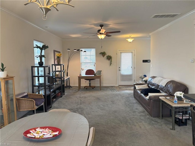 carpeted living room with ceiling fan and ornamental molding