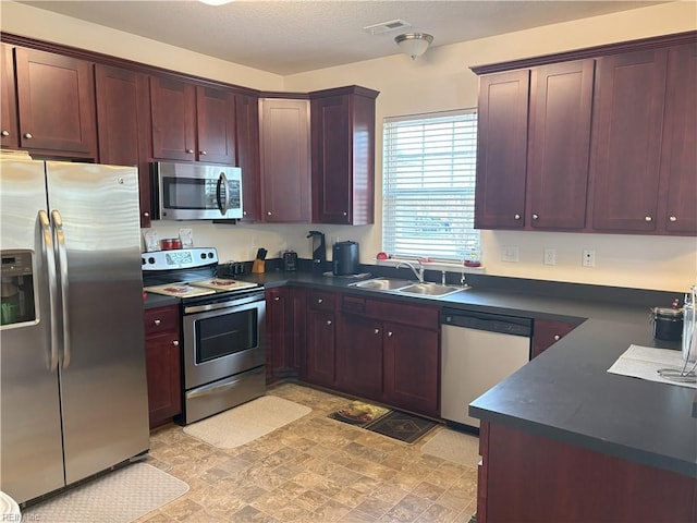 kitchen with sink and appliances with stainless steel finishes