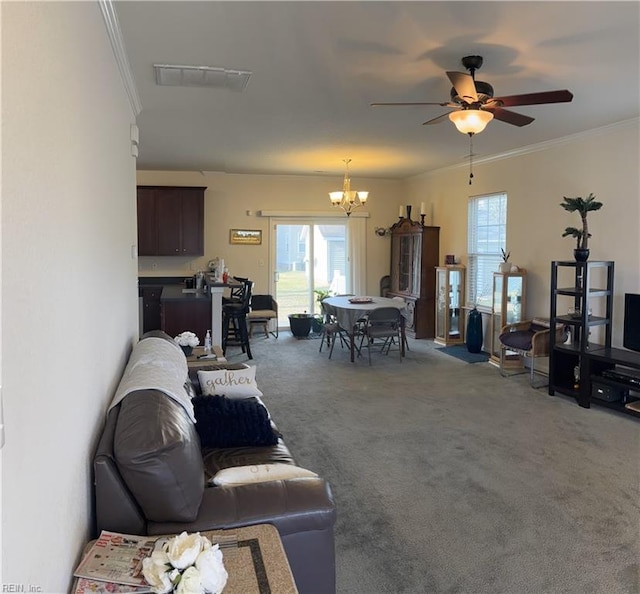 living room featuring carpet flooring, ceiling fan with notable chandelier, and ornamental molding