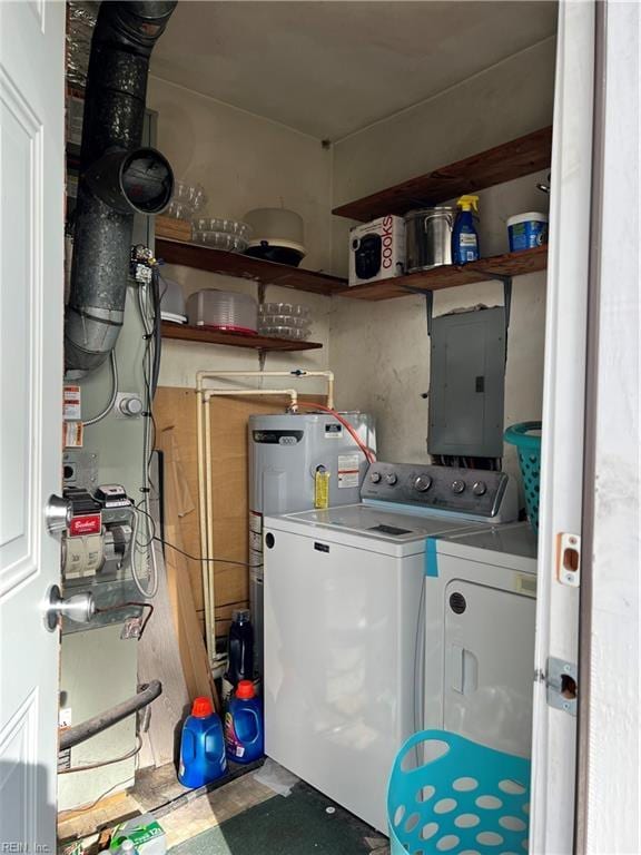 clothes washing area with washing machine and clothes dryer, electric panel, and water heater