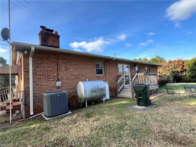 rear view of property featuring cooling unit