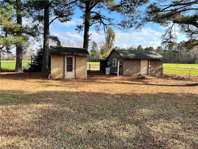 view of outbuilding with a lawn